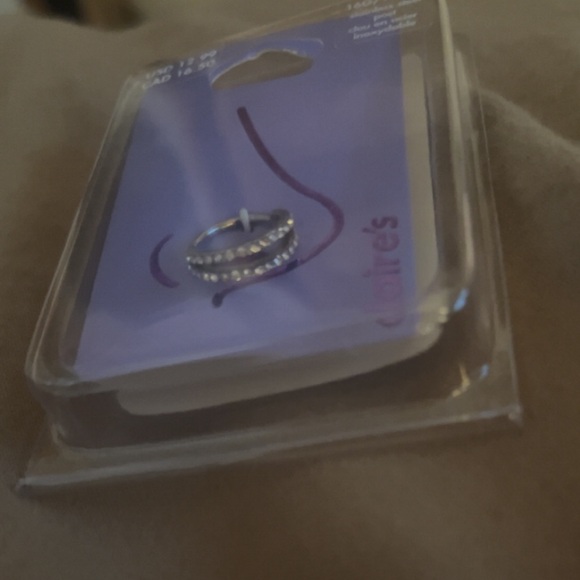 Unopened stainless steel 16G nose ring. - Picture 2 of 2